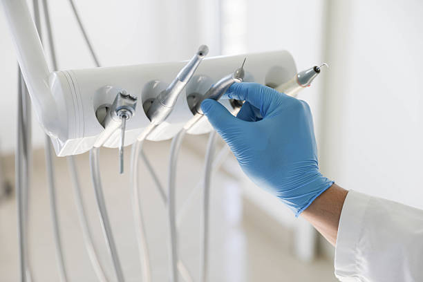 Professional Tooth Extraction technician working in Gainesville, VA